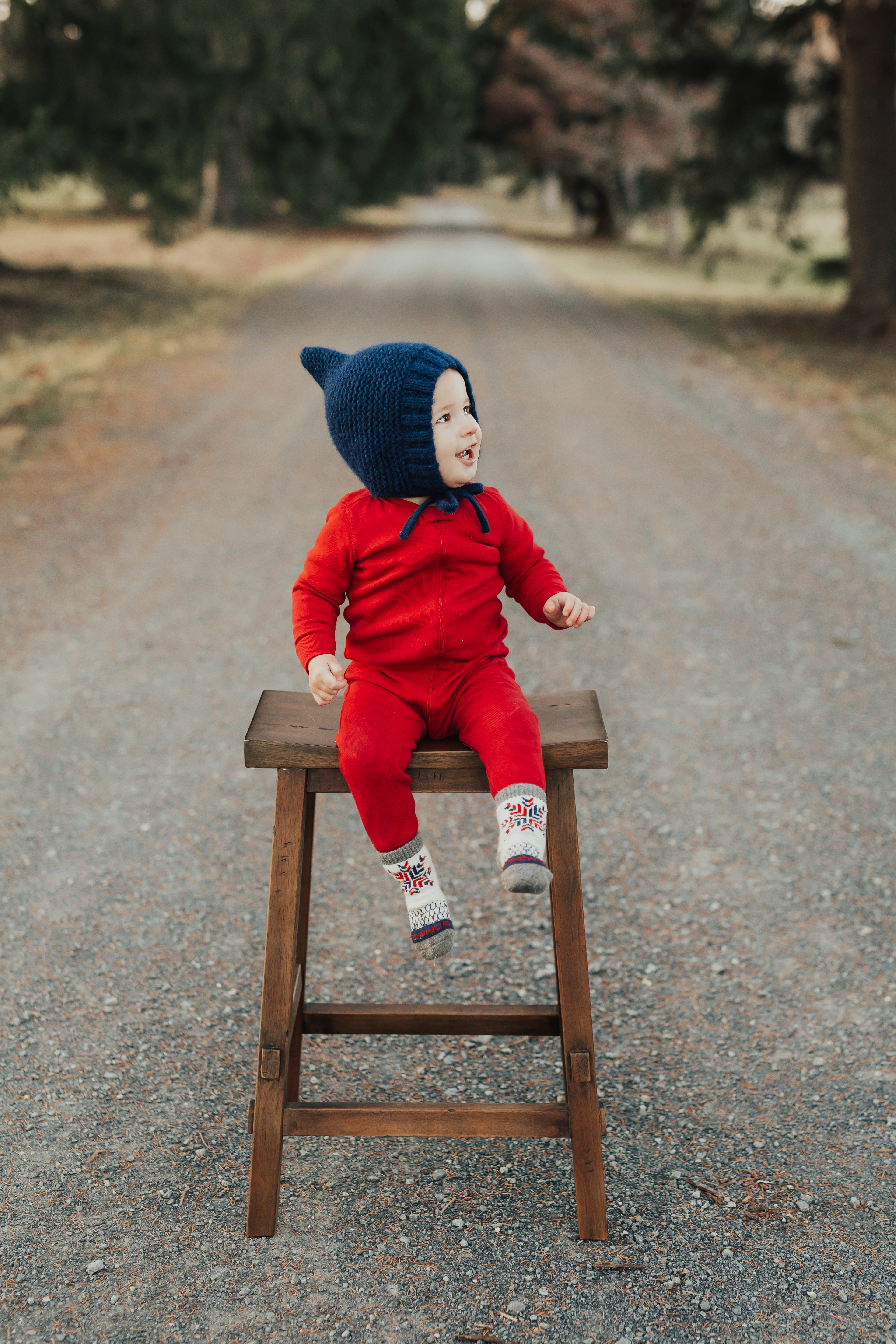 baby in red outfit sitting on stool at Morven Park