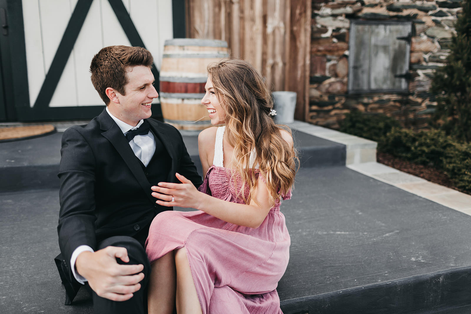 photo of a engaged couple talking on a step