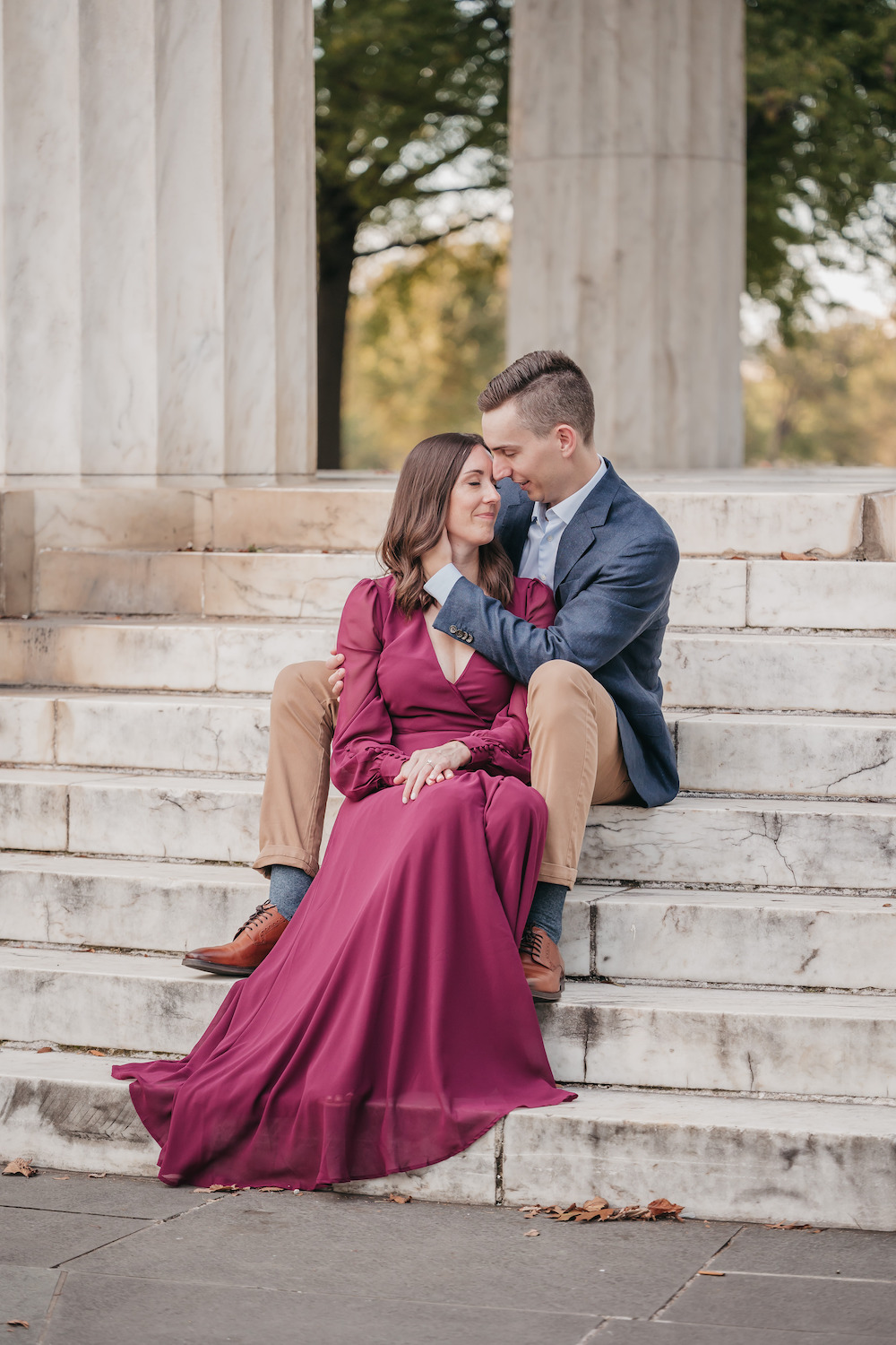 Couple sitting together on the steps during their Washington DC engagement shoot with Rachel Yearick Photography