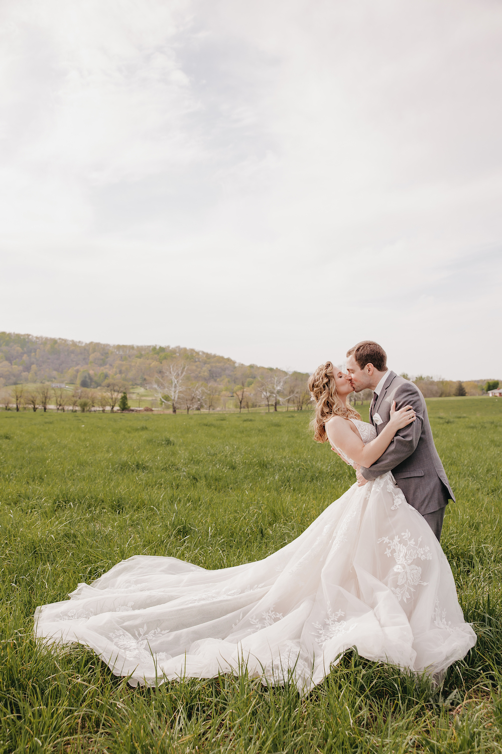 Bride and groom sharing an embrace during their wedding shoot at Fox Meadow Barn