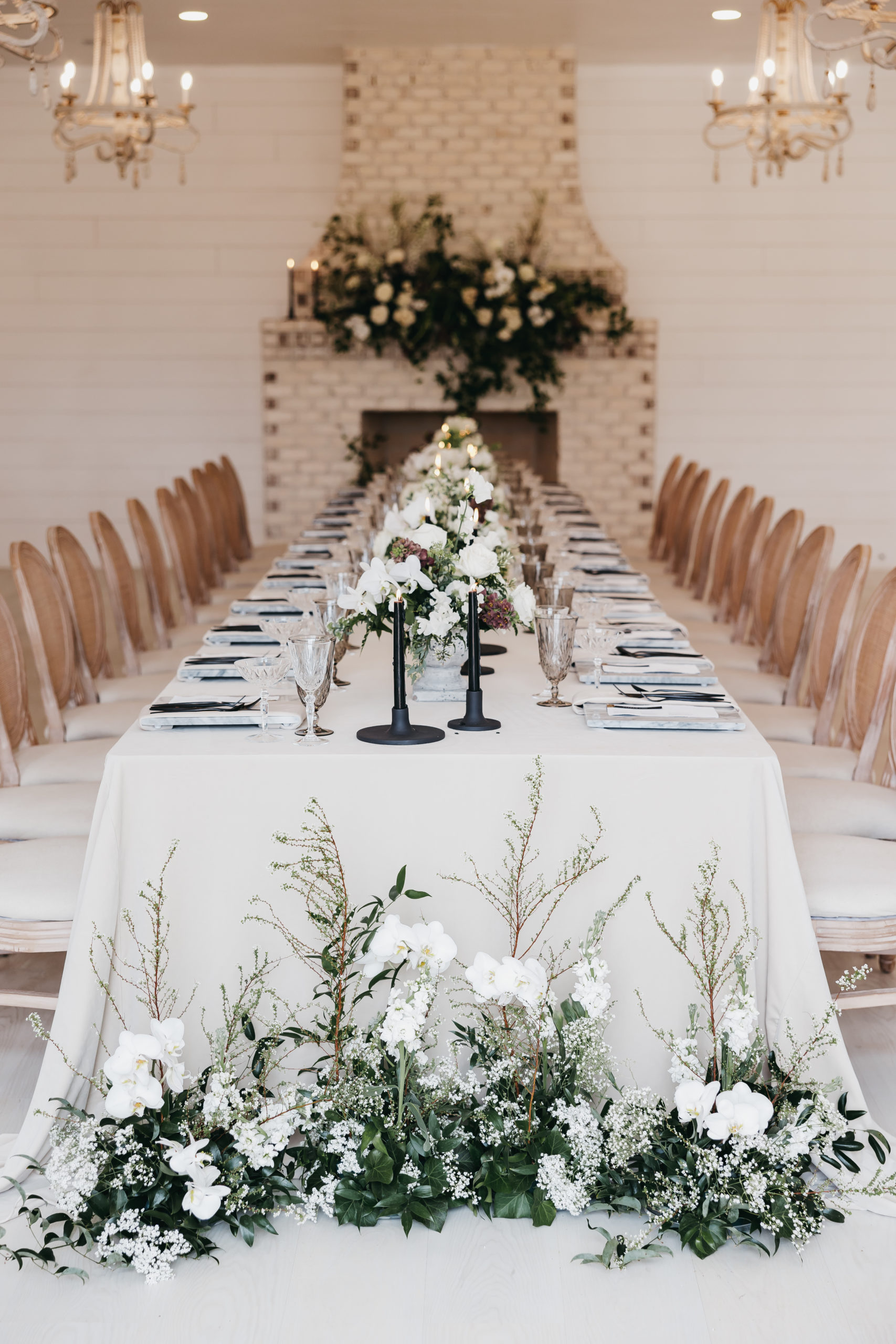How Much Should A Wedding Photographer Cost. Elegant long table setting at the reception with floral centerpieces.