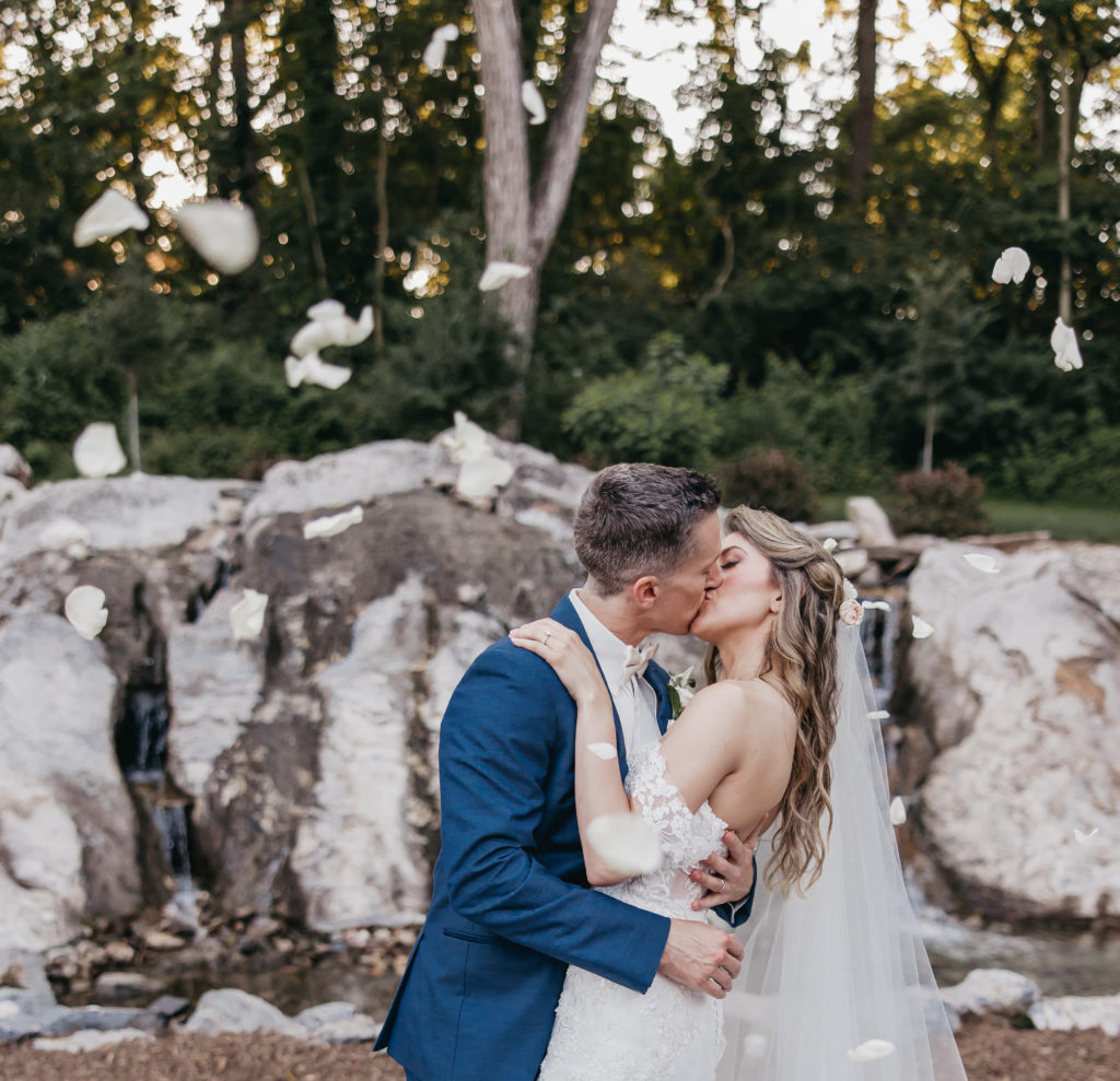 Bride and groom sharing a kiss during their wedding shoot with Christian wedding photographer Rachel Yearick