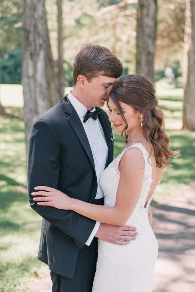 6 Reasons to Consider Timeless Wedding Photography. Couple sharing an embrace as they close their eyes.