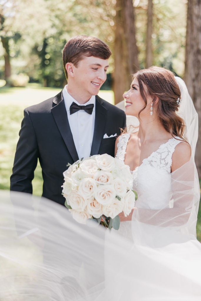 Bride and groom smiling during their wedding shoot with timeless wedding photographer Rachel Yearick