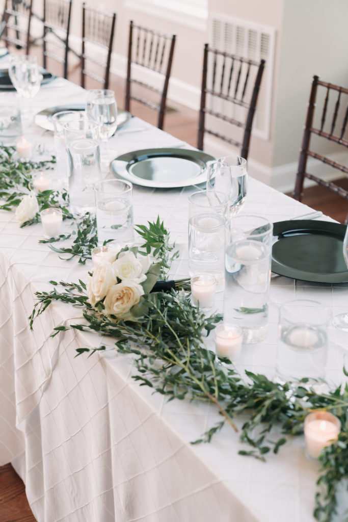 6 Reasons to Consider Timeless Wedding Photography. Wedding reception table with white roses.