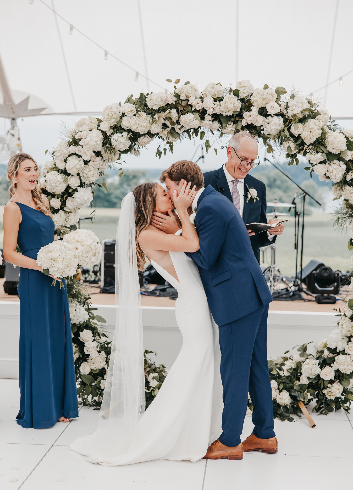 Newlywed couple sharing an embrace and a kiss during their Brittland Estates wedding shoot with Rachel Yearick Photography