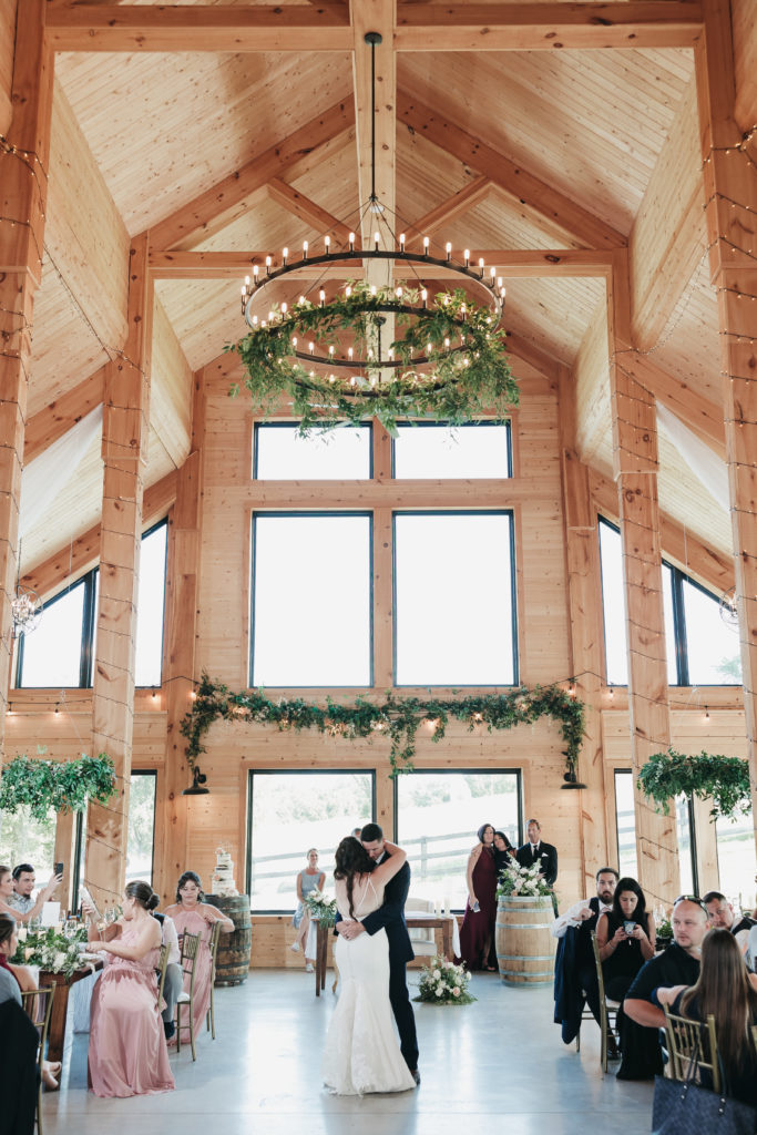 Couple sharing their first dance at the wedding reception, captured by VA wedding photographer Rachel Yearick
