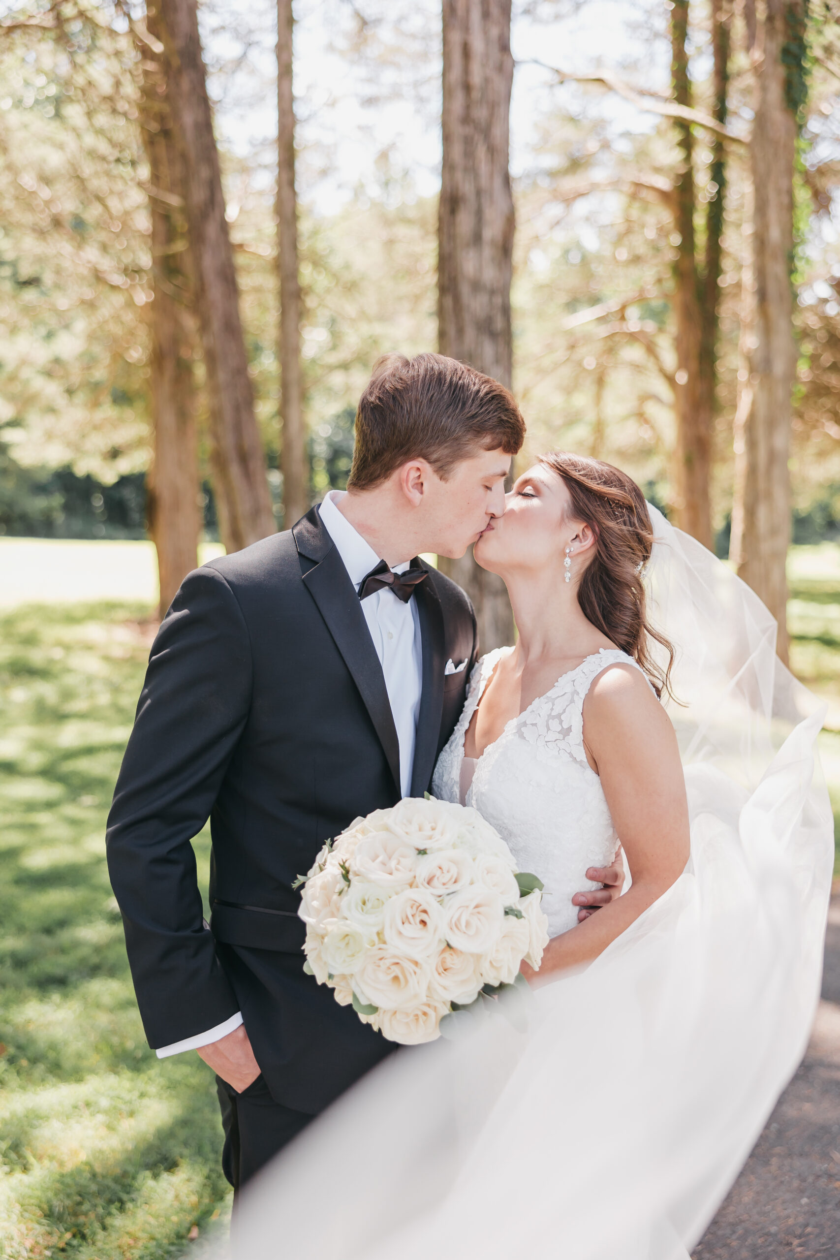 Bride and groom sharing a kiss during their wedding shoot, taken by Loudoun County wedding photographer Rachel Yearick