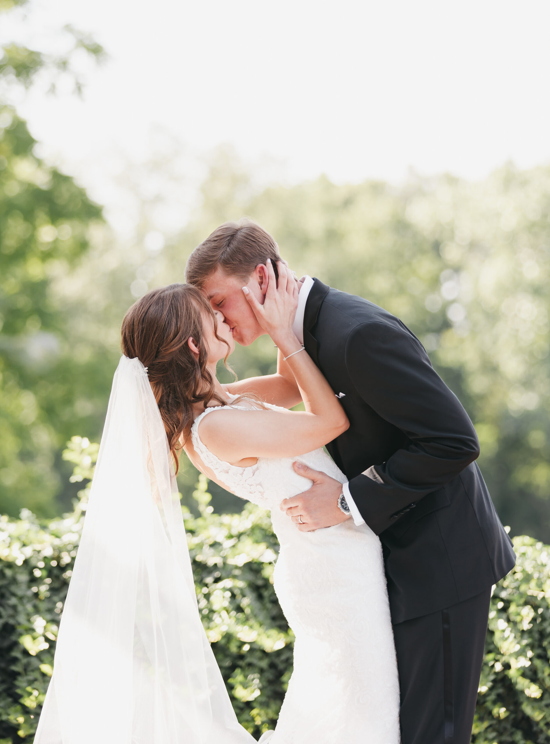 How To Find The Perfect Loudon County Wedding Photographer. Couple sharing a kiss during their wedding shoot.
