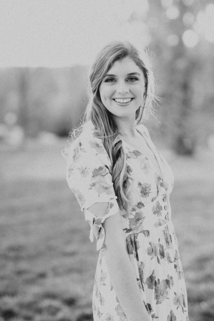 Rachel Yearick, Wedding Photographer smiling in black and white photo

