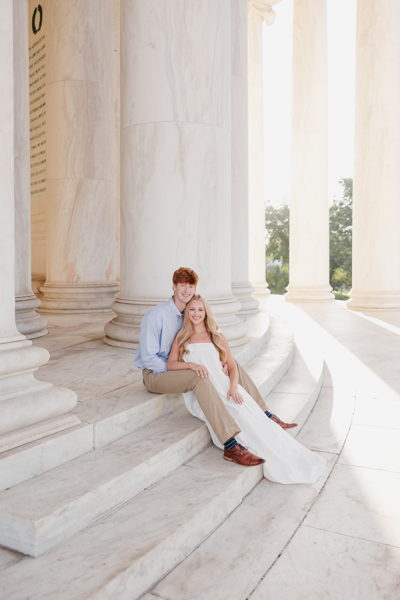 a couple walking around monuments in washington, dc
