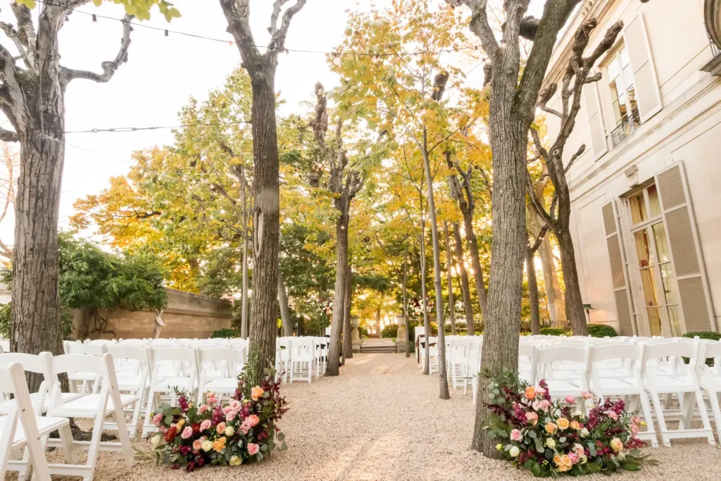 Garden ceremony at Meridian House surrounded by Linden trees and French-style mansion architecture