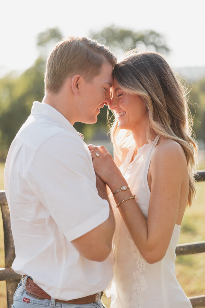 couple hugging during their late-summer engagement session in the Virginia countryside