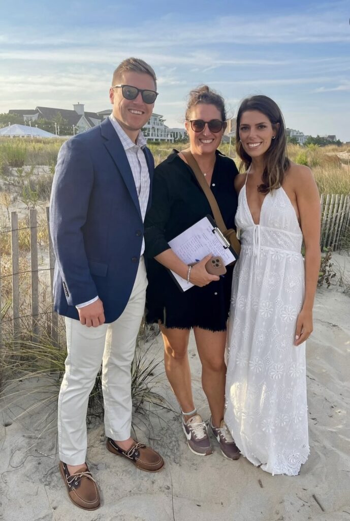 Wedding planner working with couple on a beach
