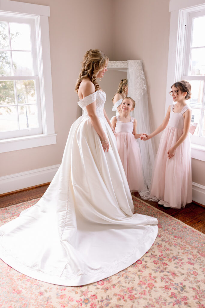 bride and flower girls at Raspberry Plain Manor during a winter wedding in Leesburg Virginia