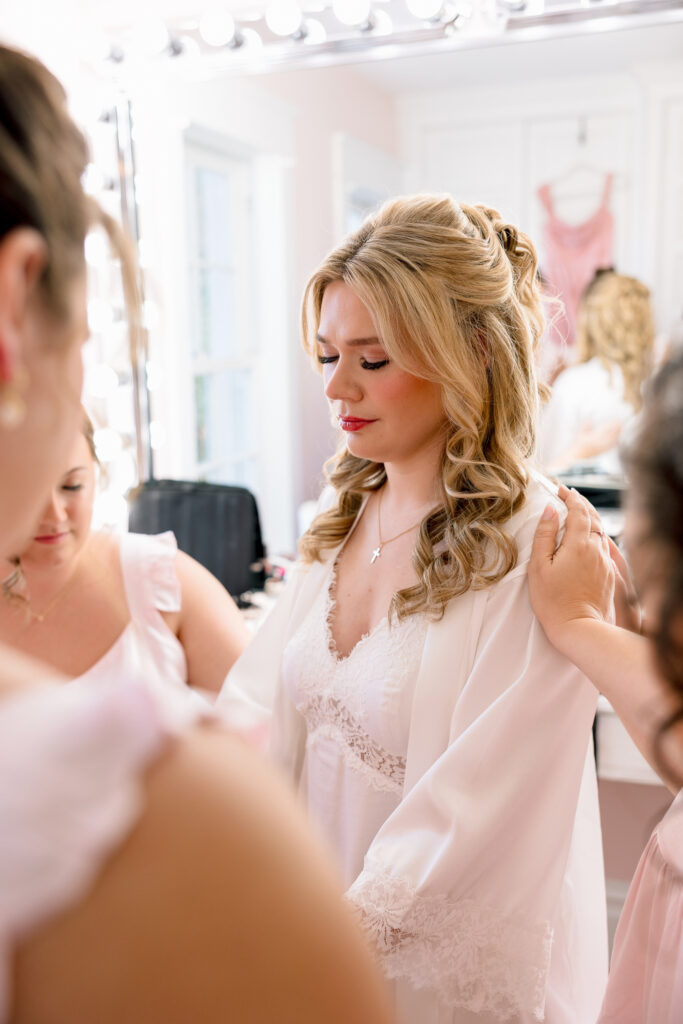 prayer time with bridesmaids at Raspberry Plain Manor during a winter wedding in Leesburg Virginia