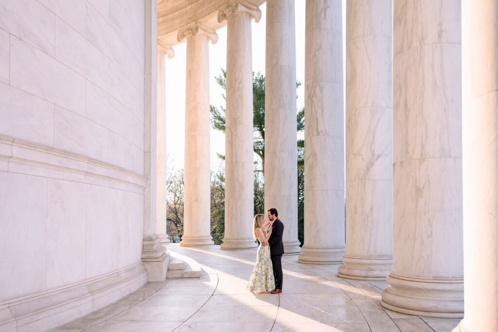 Couple walking at Jefferson Memorial during Washington DC engagement session