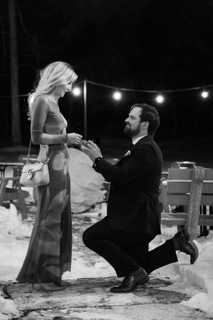 Donald proposing to Nicole at L'Auberge Chez Francois on a winter evening in Virginia
