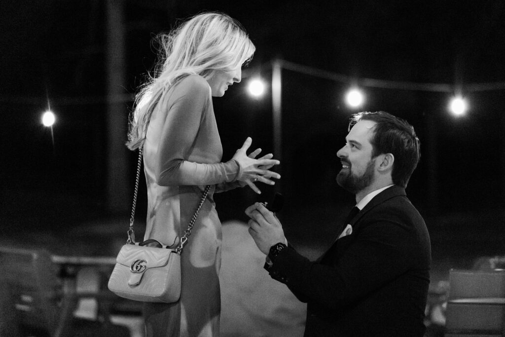 Donald proposing to Nicole at L'Auberge Chez Francois on a winter evening in Virginia